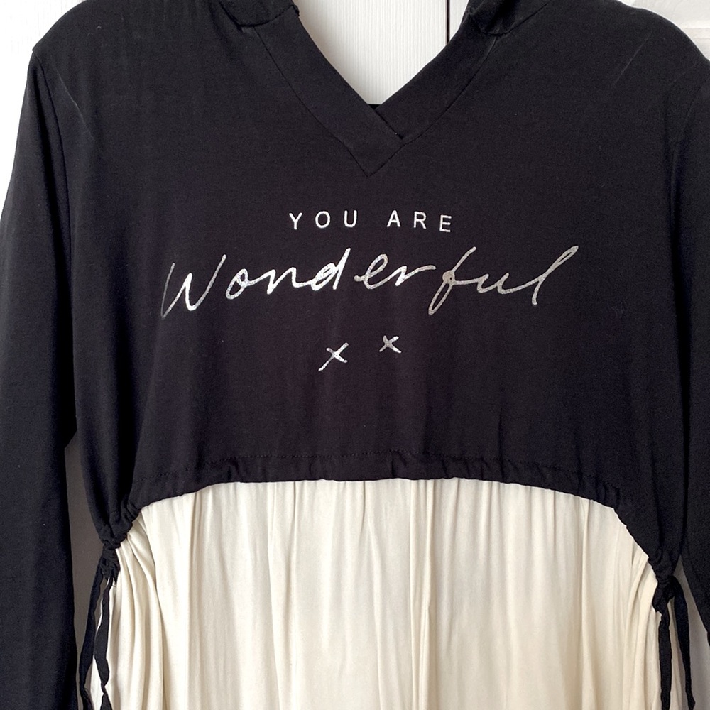 One size dress with sweatshirt and cap. Adjustable to your waist. Never worn.